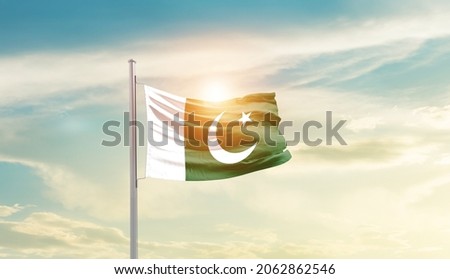 Pakistan national flag waving in beautiful sky.