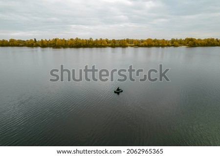 Aerial view of a fishing boat in autumn