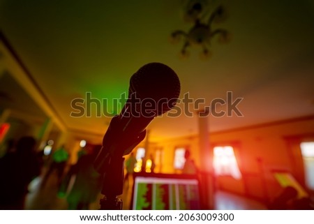 Shadow of microphone in restaraunt. Silhouette of studio musical microphone.