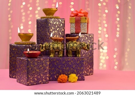 Beautiful diwali diyas with gift and flowers, Happy Diwali