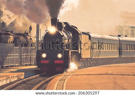 Vintage image of the departure of the retro steam train. Royalty-Free Stock Photo #206305297