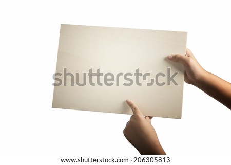 Young caucasian hands holding a light color plywood square blank signboard isolated on white background. Index finger is pointing the sign. There are no elements to distract viewer from reading