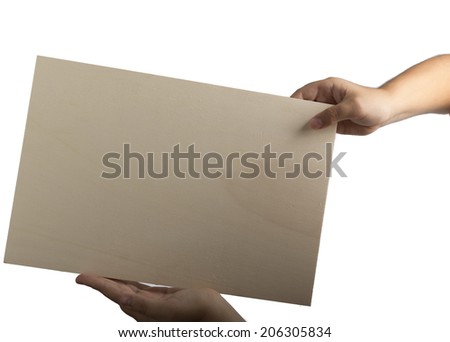 Young caucasian hands holding a light color plywood square blank signboard isolated on white background. There are no elements to distract viewer from reading any  message written on the sign