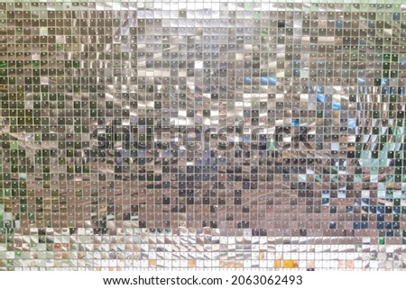 Full frame silver sequins curtain background texture.