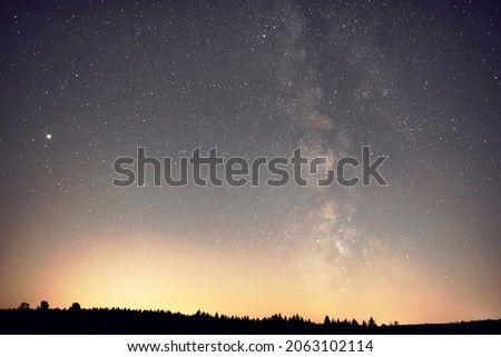 Universe with Milky Way in the night sky.