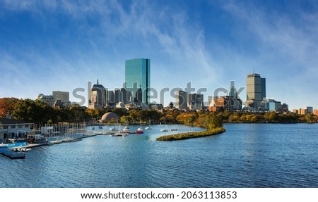 Boston Skyline at Autumn showing Charles River Esplanade at early morning with fall foliage. The Charles River Esplanade of Boston, MA, is a state-owned park in the Back Bay area of the city.