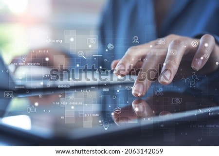 IoT, Internet of Things, global network, E-learning, online study concept. Business person working on laptop computer and digital tablet with technology icon on virtual screen. Student studying online Royalty-Free Stock Photo #2063142059