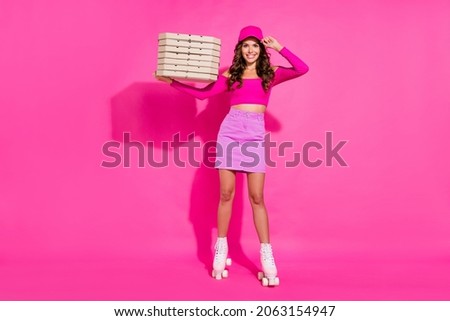 Full body portrait of cheerful positive girl arm touch headwear character fifties isolated on pink color background