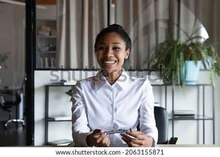Profile picture of friendly asian female teacher sit at work desk give remote lesson lecture class online using webcam app. Web cam portrait of young ethnic lady business trainer coach leading webinar