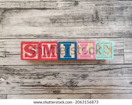 Smile. Smile word from wooden letter blocks. Suitable for educational media for children