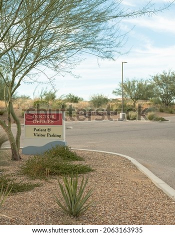 Doctor offices and patient visitor parking sign on empty lot. High quality photo