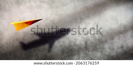 Think Big, Startup and Motivation Concept. Paper AirPlanes Flying Up and Shading Shadow as Aircraft on the Wall   Royalty-Free Stock Photo #2063176259