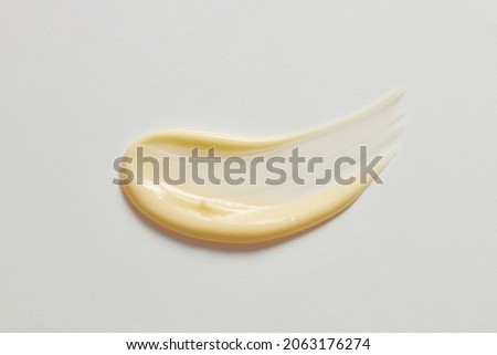 yellow cream wave in white background for cosmetic advertising 