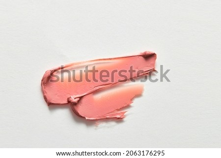 double wave of red lipstick in white background for cosmetic advertising