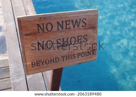 Sign showing "No News, No Shoes" picture took in a resort at Maldives