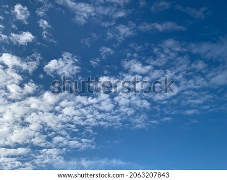 Altocumulus clouds are full of streaks of beautiful usually appear between lower stratus clouds and higher cirrus clouds photographed over at Thailand.no focus Royalty-Free Stock Photo #2063207843