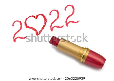 Lipstick and 2022 isolated on white background