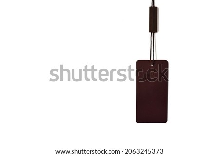 Empty brown tag hanging on a white background