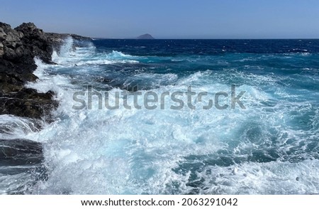 Photo of the wild ocean with waves at the coast of the island Tenerife in the Atlantic Ocean.