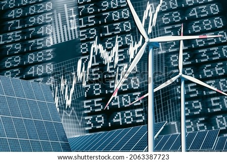 Wind turbines and solar panel with price board, stock prices and diagrams