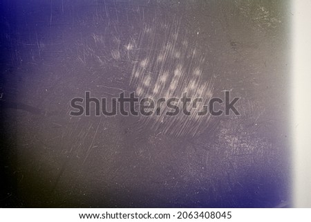 Blank grained toned film strip texture background with heavy grain and dust