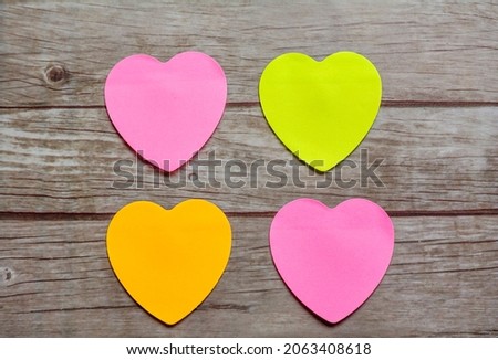 Empty sticky notes in heart shape