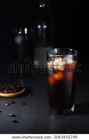 Cold coffee with ice in low key	