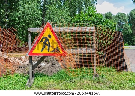 Sign warning about the repair or construction of the road and excavation