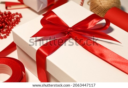 A beautiful red gift with Christmas ornaments