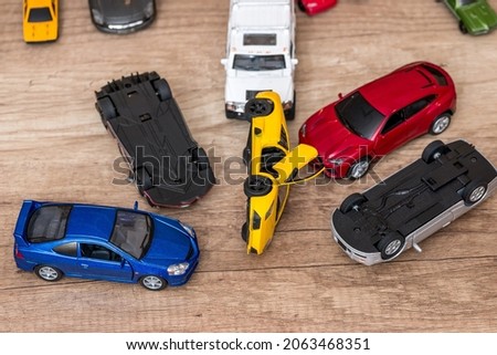 Many small toy cars on desk