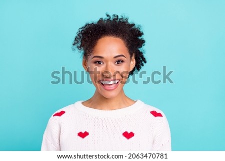 Photo of pretty excited african lady dressed white sweater smiling isolated blue color background