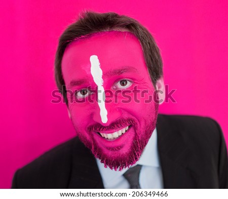 Portrait of adult man with colorful painted face
