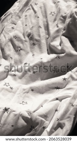 Design star pattern in white cotton fabric