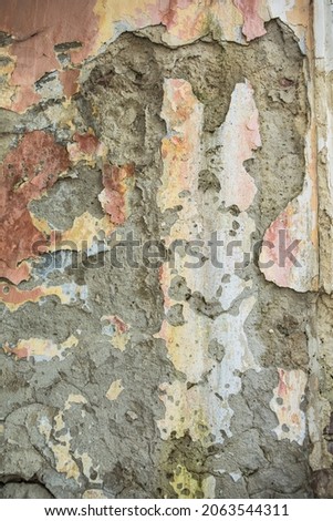 Old rough pink-orange plaster wall surface Artistic. Walls and background, yellow concrete surface
