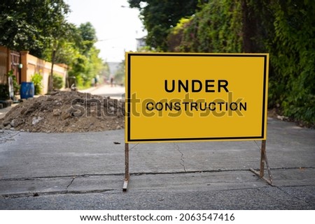 building structure with message under construction. Under Construction Concept with stop sign. 