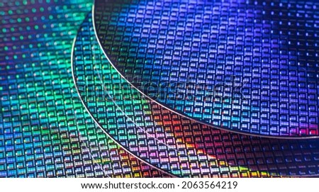Silicon Wafer with microchips used in electronics for the fabrication of integrated circuits. Royalty-Free Stock Photo #2063564219