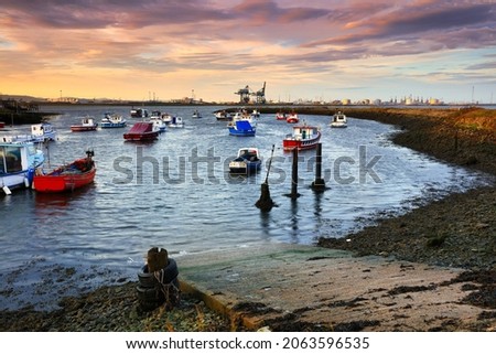 Warm Morning Light on Fishing Boats at South Gare, Middlesbrough, North Yorkshire, England, UK.