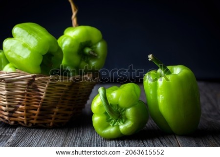 Raw fresh bell pepper on wooden background