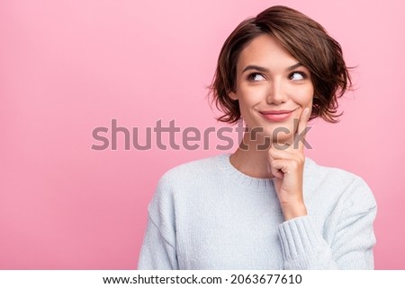 Photo of cheerful minded young positive woman dream look empty space hand chin isolated on pink color background Royalty-Free Stock Photo #2063677610