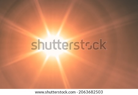 Star shape sun flair, ray of sunshine abstract Royalty-Free Stock Photo #2063682503