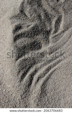 close-up traces on sand background