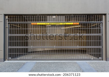 Automatic garage door at a modern building with a sign