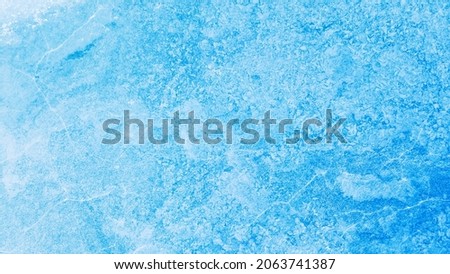 Aerial view of frozen lake. Ice from drone view. Background texture concept.