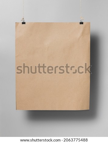 Brown paper sheet in holders with shadow on gray background,mock up empty paper blank