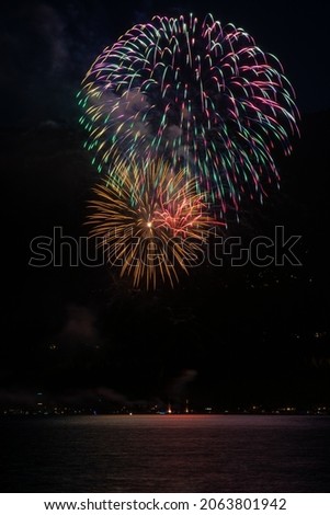 A photograph of fireworks on 4th of July over Lake Tahoe and Incline Village, Nevada