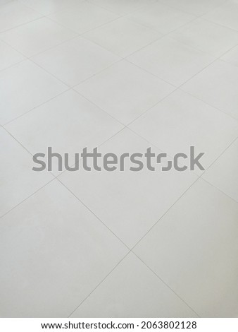 White tiling with geometric line for background. Clean surface and symmetry with grid line texture or pattern. For decoration