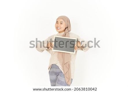 Showing, Presenting and holding Blank Blackboard  of Beautiful Asian Woman Wearing Hijab Isolated On White Background