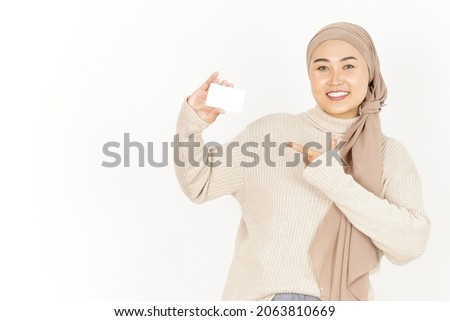 Holding and showing blank credit card of Beautiful Asian Woman Wearing Hijab Isolated On White Background