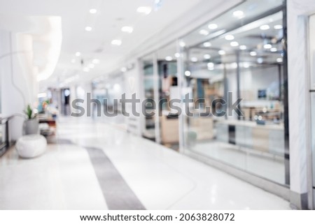 Abstract blurred photo of shopping zone background,Blurred of people walking in shopping mall:blur of department store indoors,blurred of shopping mall.vacation weekend day  Royalty-Free Stock Photo #2063828072