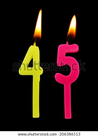 Birthday candle on black background, number 45